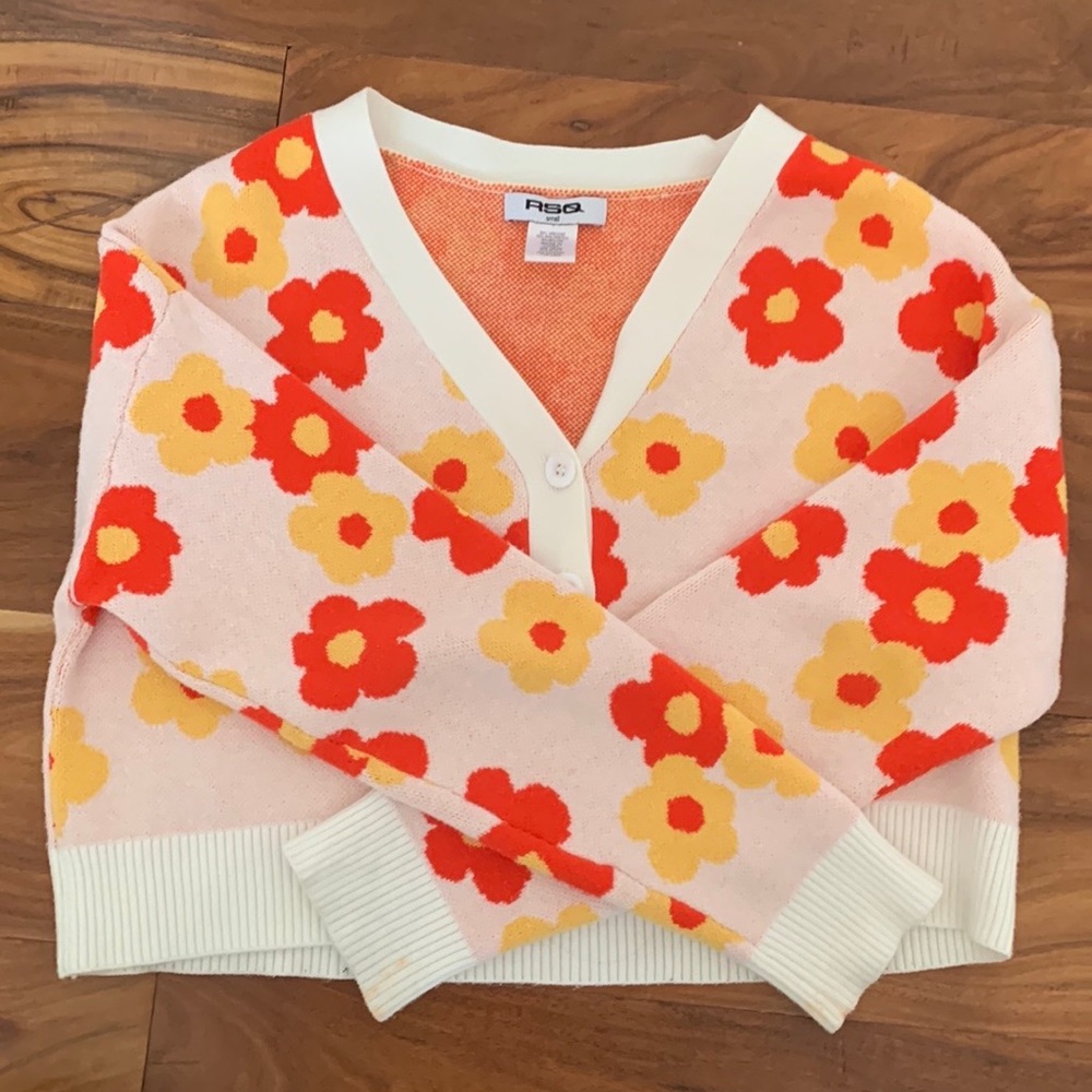 Small floral cardigan with the button up front. Barely worn great condition.